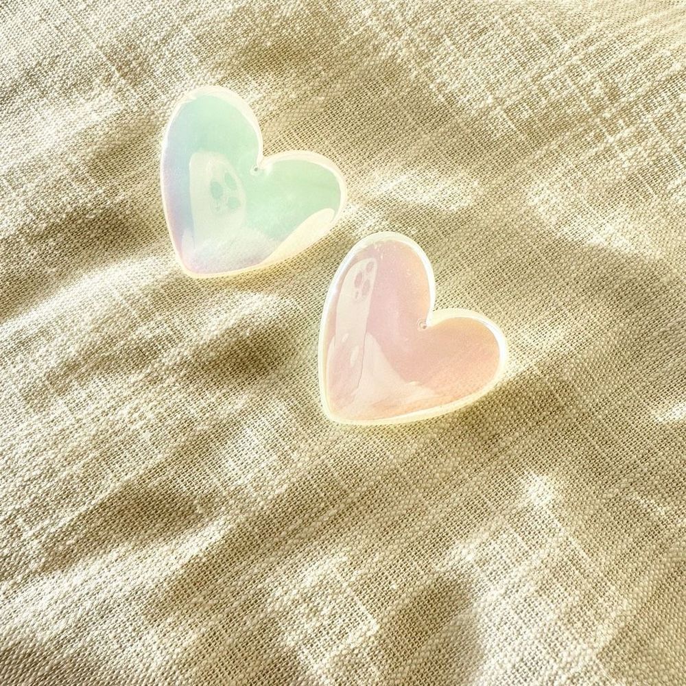 Iridescent white heart shaped stud earrings